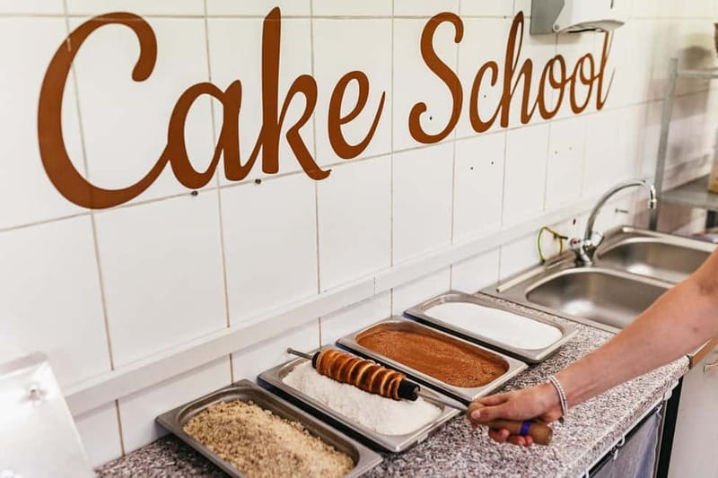 Budapest: Hungarian Chimney Cake Workshop in the City Center - Flavoring your chimney cakes: choosing between sugar, coconut, and cinnamon