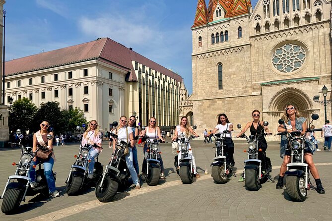Monster Bike Sightseeing Tour - City Budapest on Electric Rollers - Shoes on the Danube Bank, Parliament, and the bridge-to-basilica storyline
